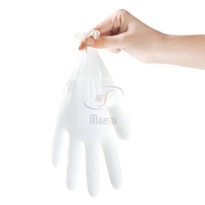 El hogar pulveriza los guantes claros libres del vinilo para la limpieza de la alimentación